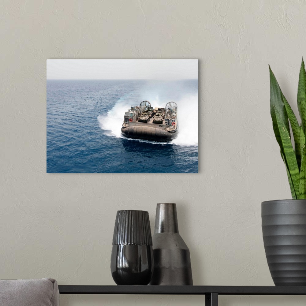 A modern room featuring A landing craft air cushion transits the Gulf of Aden.