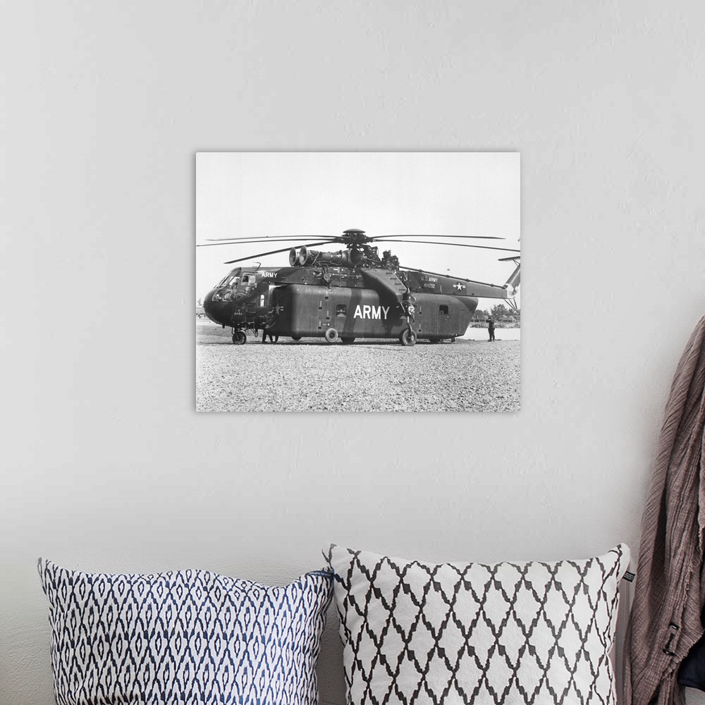 A bohemian room featuring A large CH-54 Skycrane helicopter used during Vietnam War.