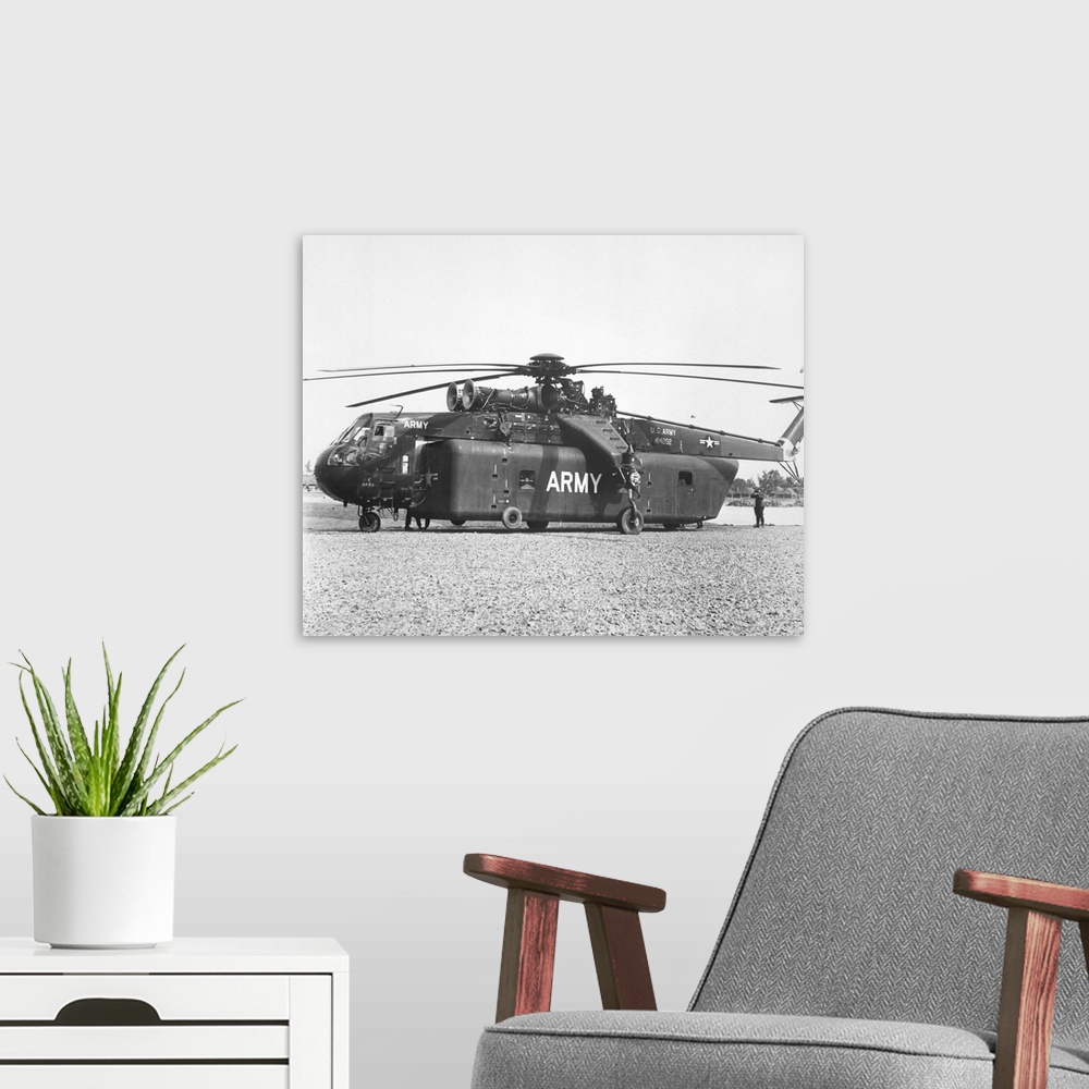 A modern room featuring A large CH-54 Skycrane helicopter used during Vietnam War.