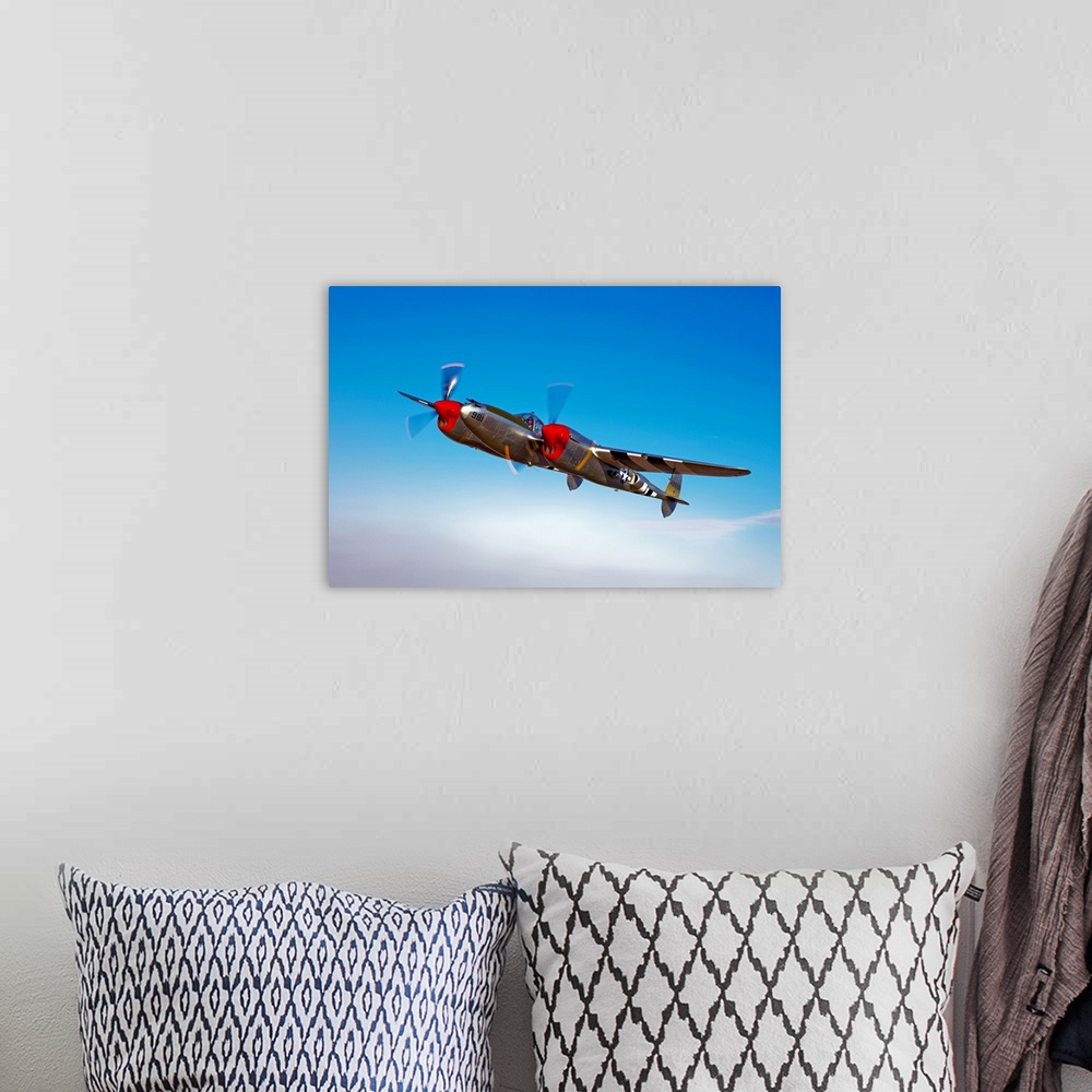 A bohemian room featuring A Lockheed P-38 Lightning fighter aircraft in flight near Chino, California.