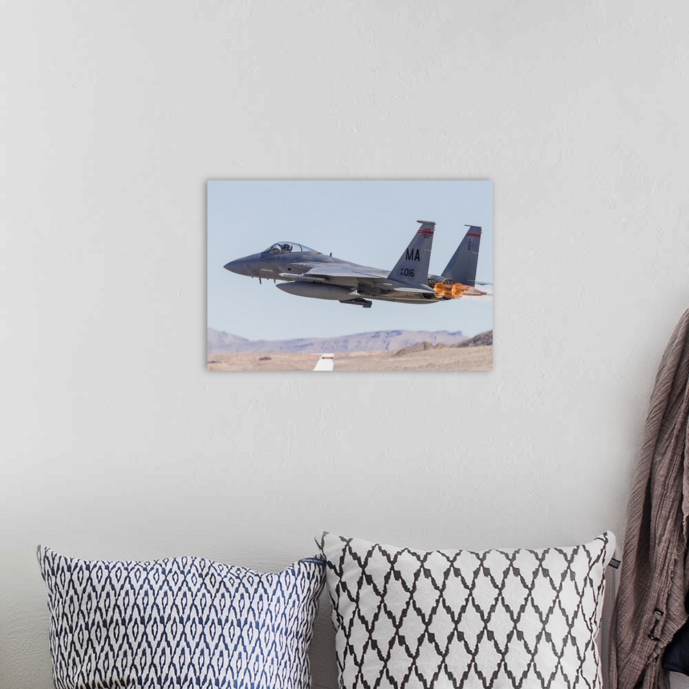 A bohemian room featuring A Massachusetts Air National Guard F-15C Eagle takes off from Nellis Air Force Base, Nevada, on a...