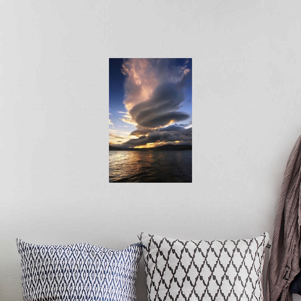 A bohemian room featuring A massive stacked lenticular cloud over Tjedsundet in Troms County, Norway.