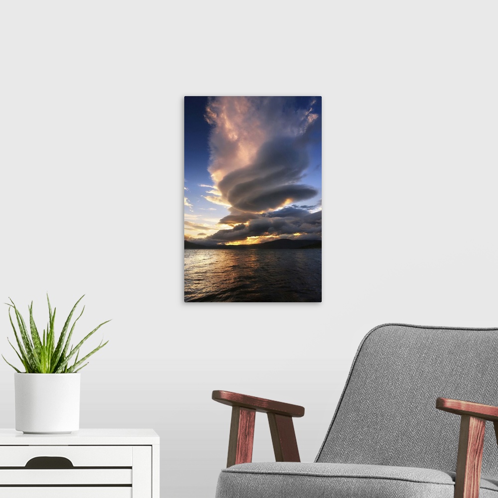 A modern room featuring A massive stacked lenticular cloud over Tjedsundet in Troms County, Norway.