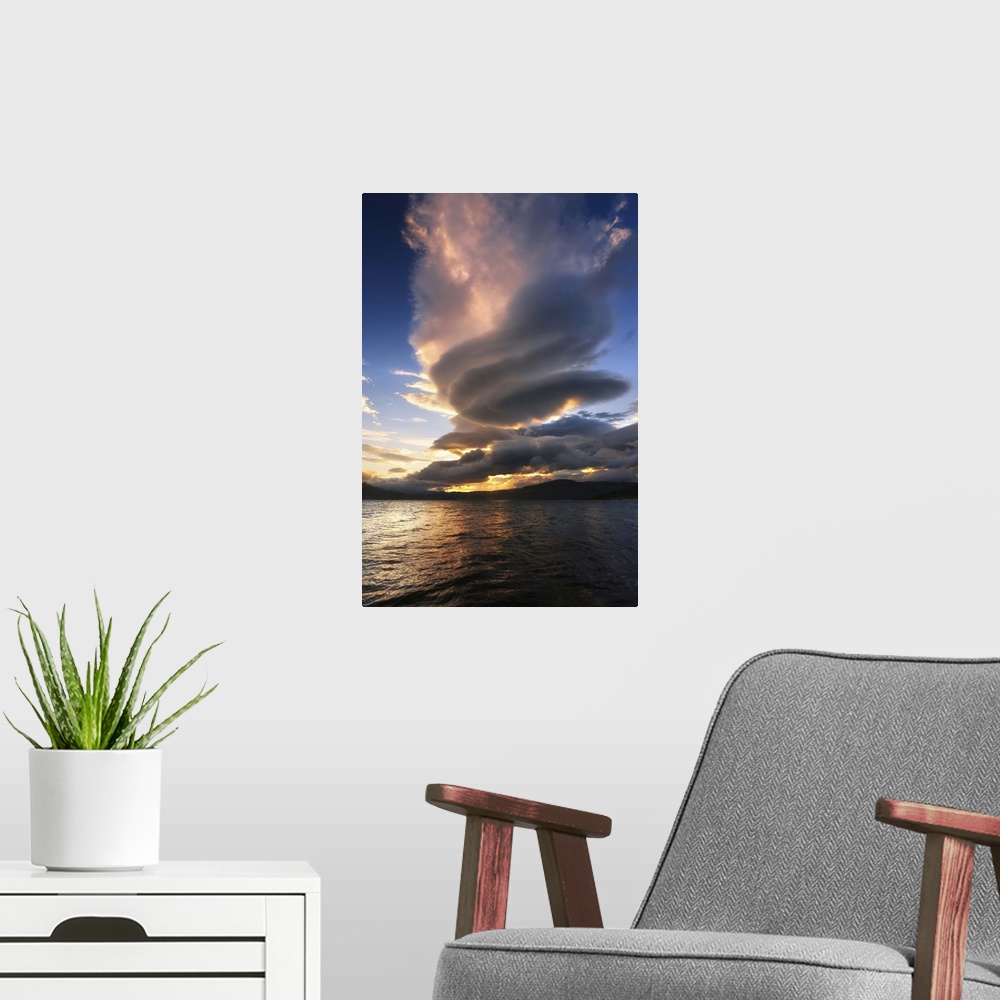 A modern room featuring A massive stacked lenticular cloud over Tjedsundet in Troms County, Norway.