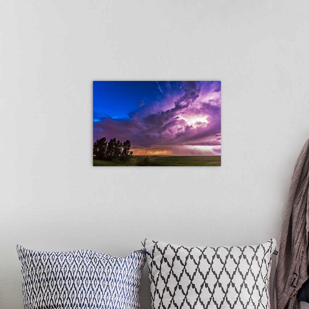 A bohemian room featuring June 20, 2014 - A massive thunderstorm moves across the northern horizon lit internally by lightn...