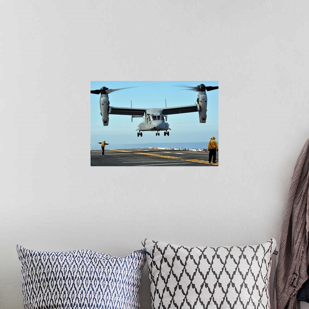 A bohemian room featuring March 1, 2011 - A U.S. Marine Corps MV-22 Osprey aircraft prepares to land on the flight deck of ...
