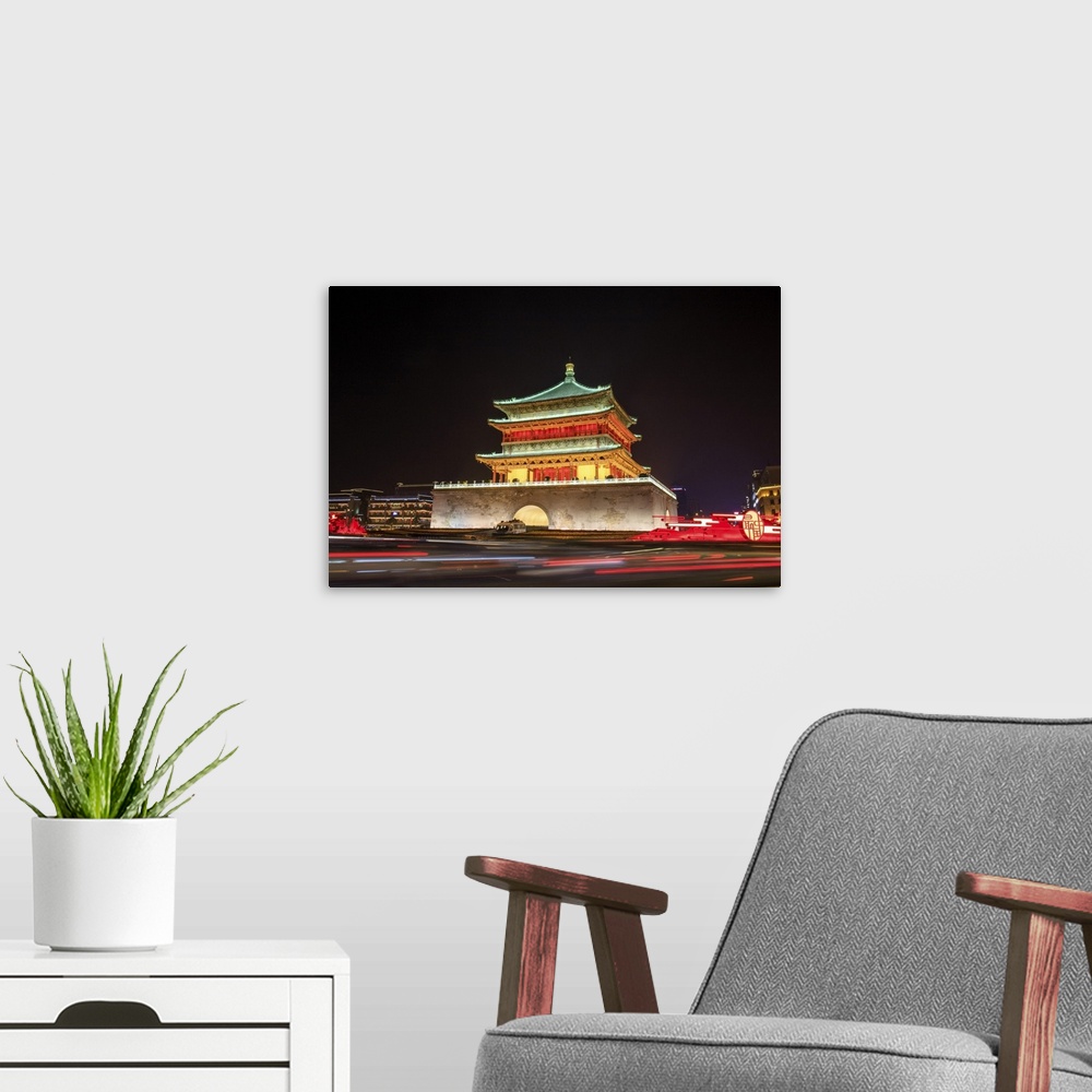 A modern room featuring A night view of Gulou tower in Xian, China.