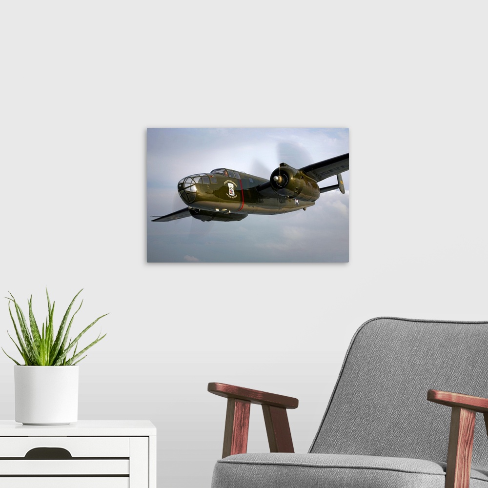 A modern room featuring A North American B-25 Mitchell in flight over Galveston, Texas.