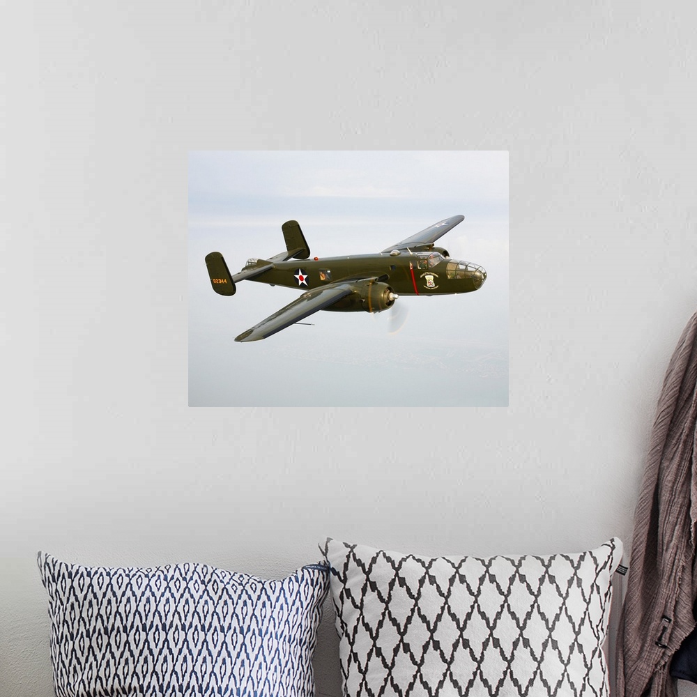 A bohemian room featuring A North American B-25 Mitchell in flight over Galveston, Texas.