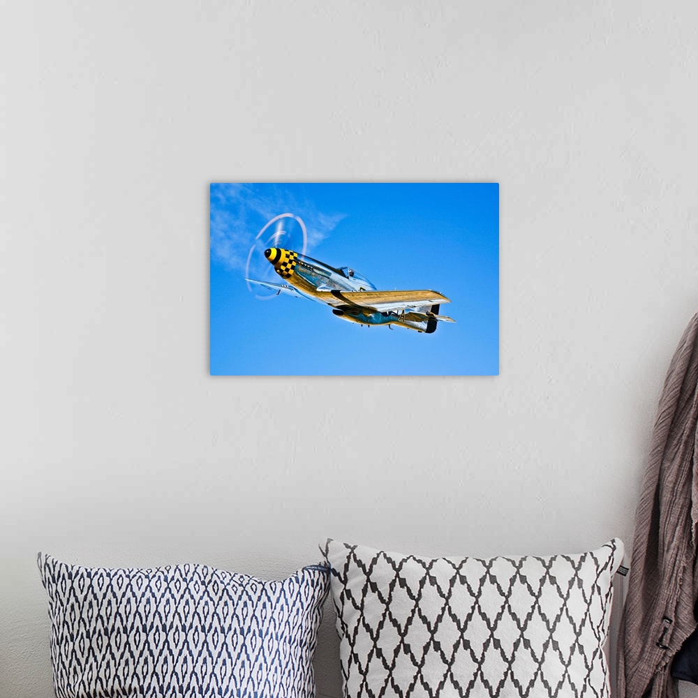 A bohemian room featuring A North American P-51D Mustang in flight near Chino, California.