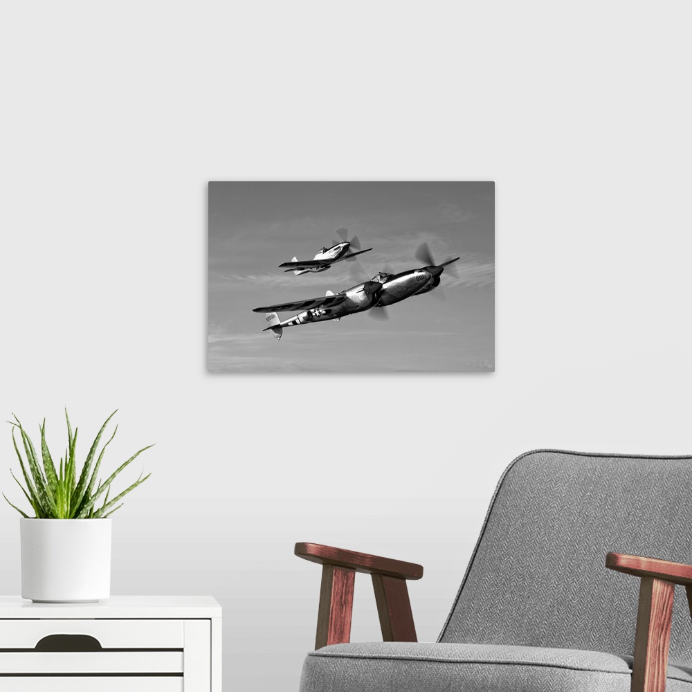 A modern room featuring A P-38 Lightning and P-51D Mustang in flight over Chino, California.