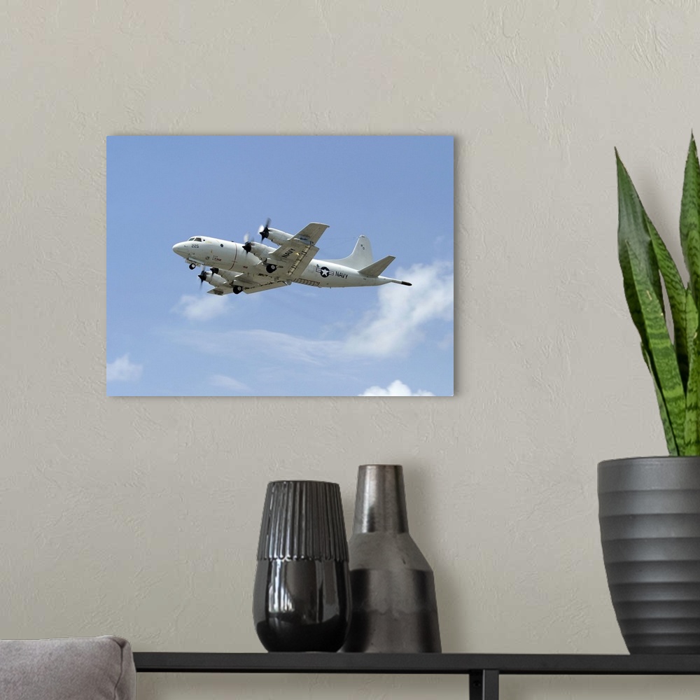 A modern room featuring Kaneohe, Hawaii, July 14, 2012 - A P-3C Orion aircraft takes off from Marine Corps Base Hawaii to...