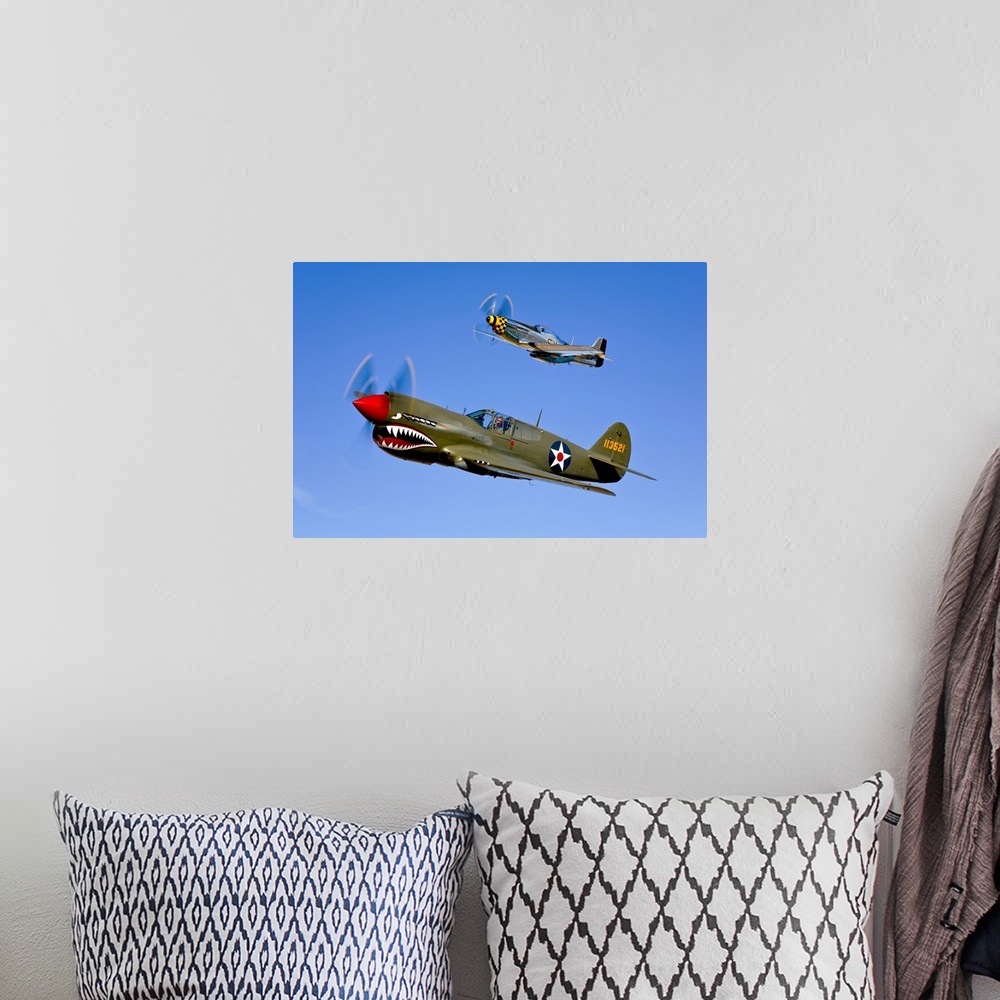 A bohemian room featuring Photograph taken of classic military aircrafts as they fly in sync across a clear blue sky.