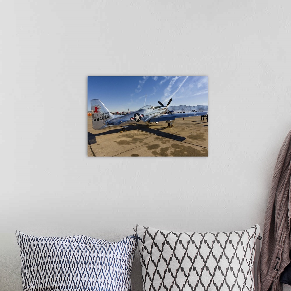 A bohemian room featuring A P-51 Mustang parked on the ramp at Nellis Air Force Base, Nevada.