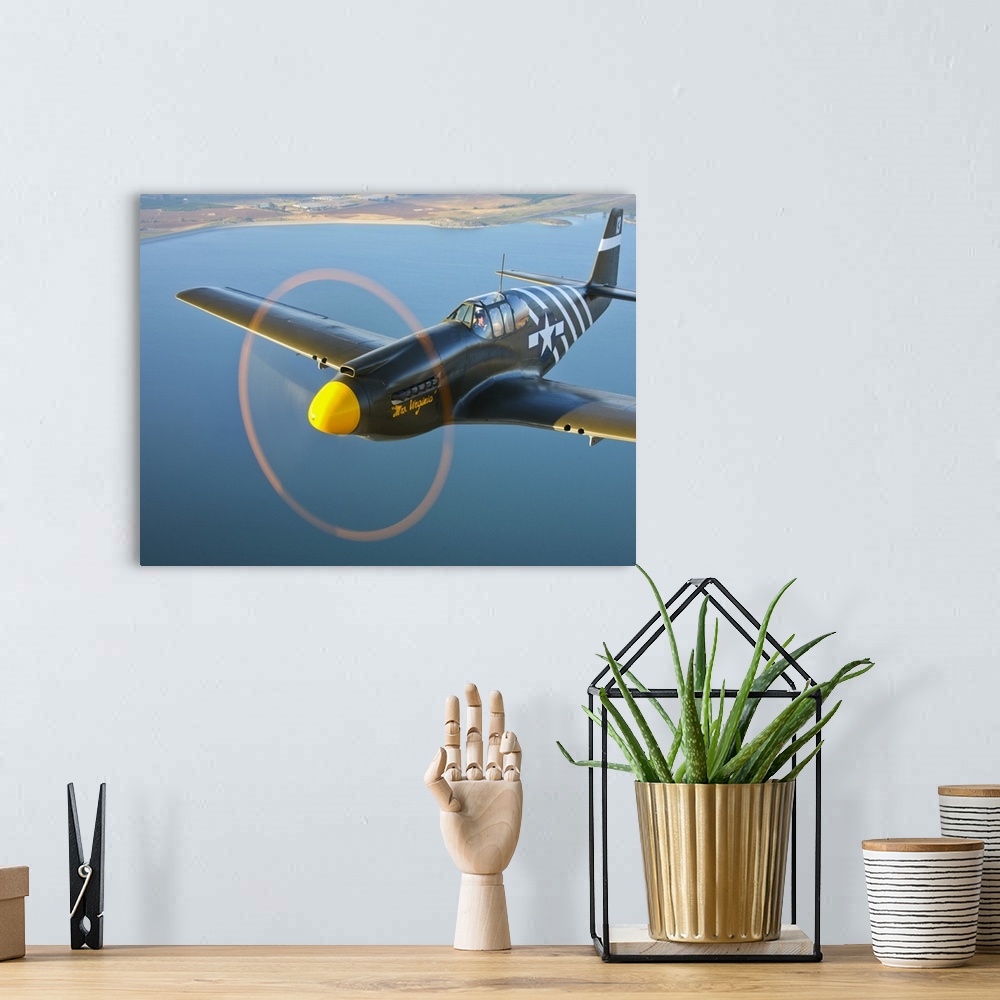 A bohemian room featuring A P-51A Mustang in flight near Chino, California.