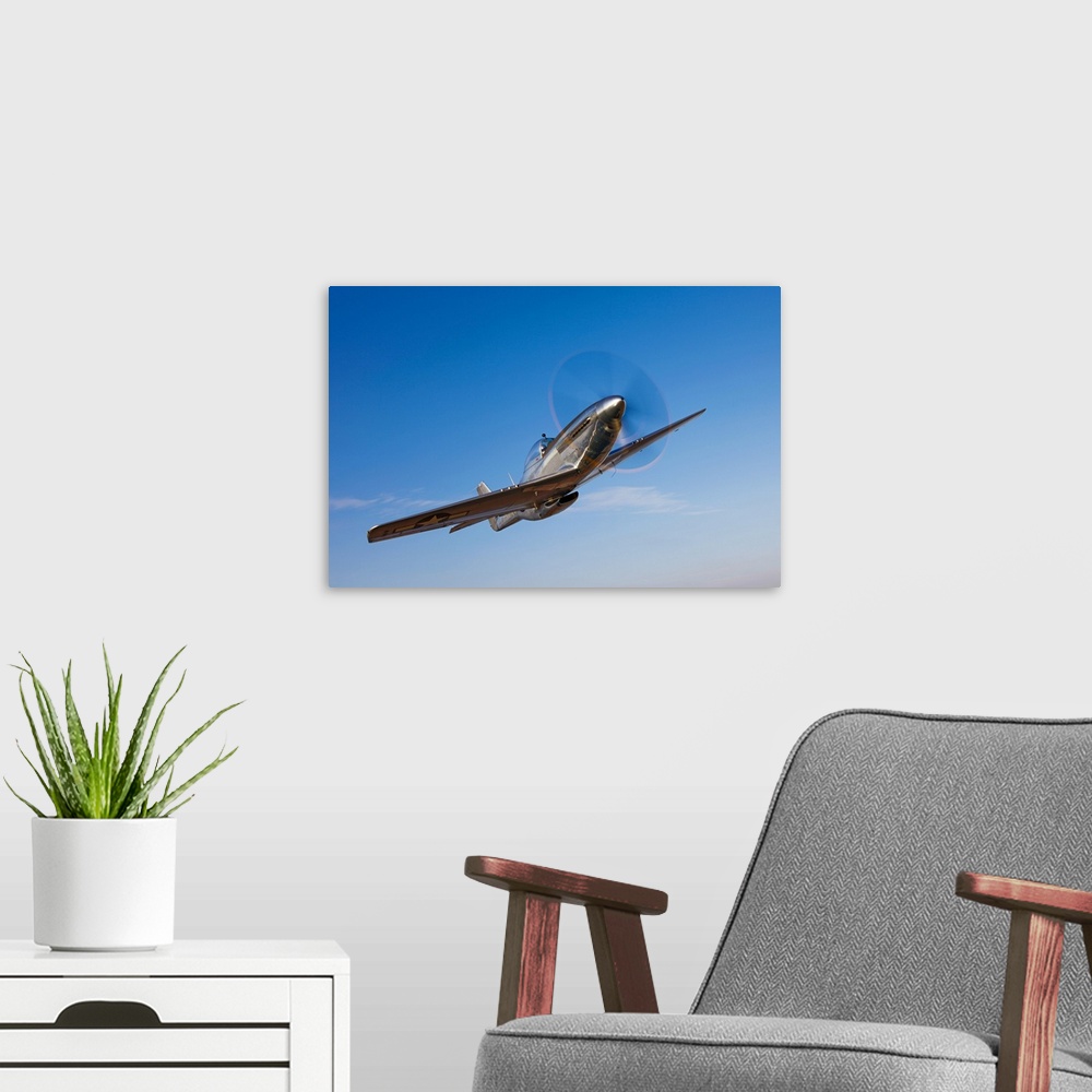 A modern room featuring Landscape photograph on a large canvas of a P-51D Mustang in flight, against a bright blue sky ne...