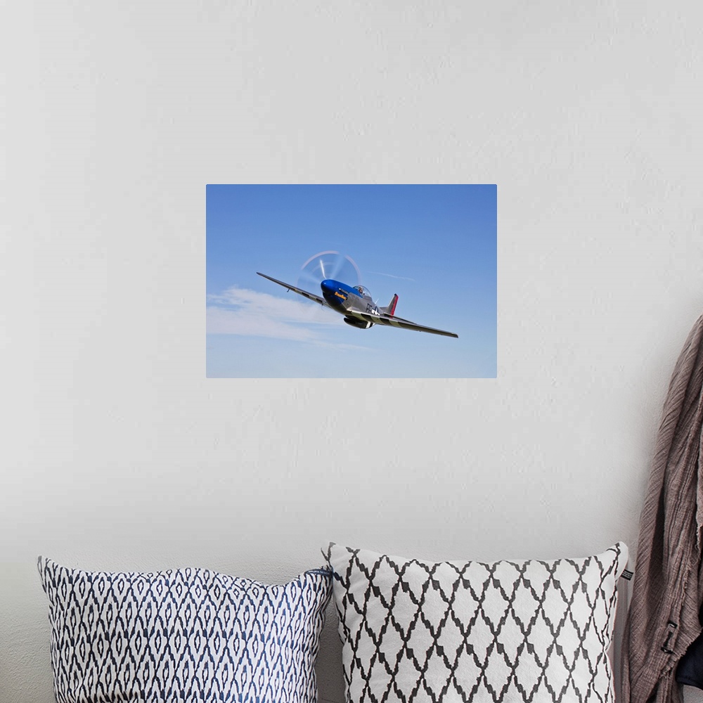 A bohemian room featuring A P-51D Mustang in flight over Hollister, California.