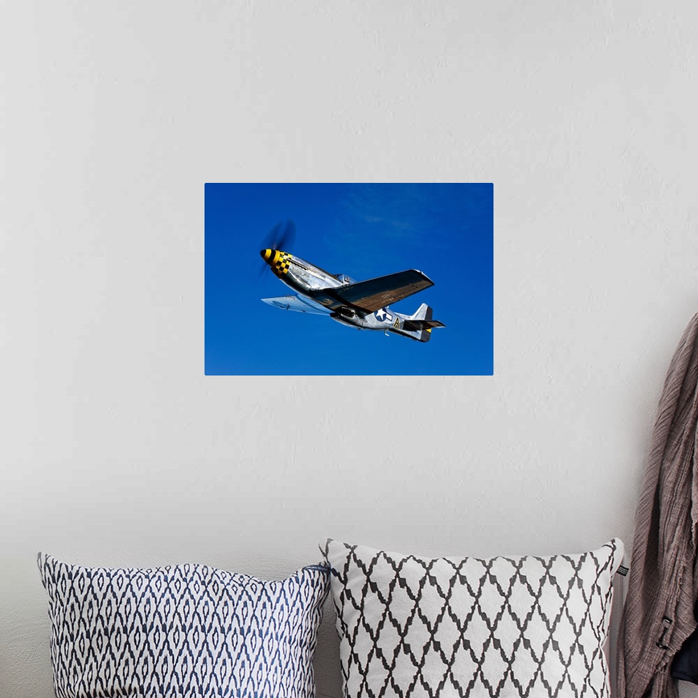 A bohemian room featuring A P-51D Mustang Kimberly Kaye in flight near Chino, California.