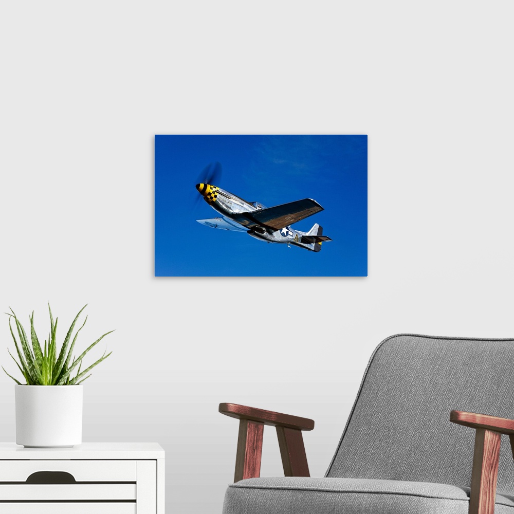A modern room featuring A P-51D Mustang Kimberly Kaye in flight near Chino, California.