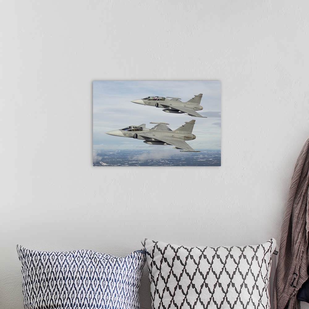 A bohemian room featuring A pair of Swedish Air Force JAS-39 Gripen fighter jets in flight over northern Sweden.