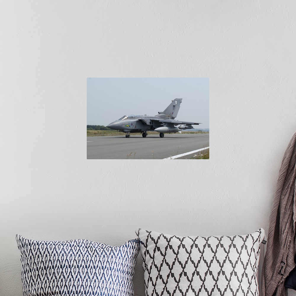 A bohemian room featuring A Panavia Tornado GR4 of the Royal Air Force on the runway, Florennes, Belgium.