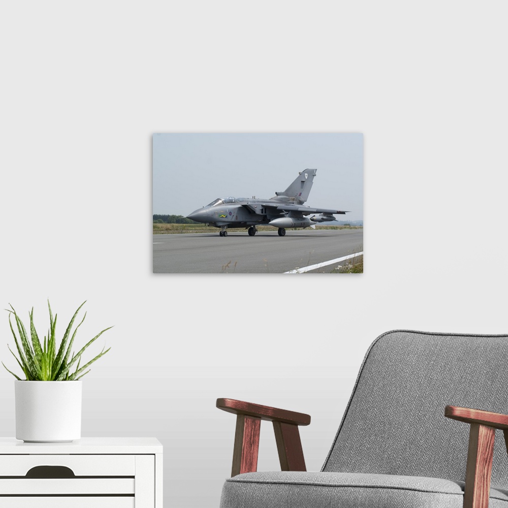 A modern room featuring A Panavia Tornado GR4 of the Royal Air Force on the runway, Florennes, Belgium.