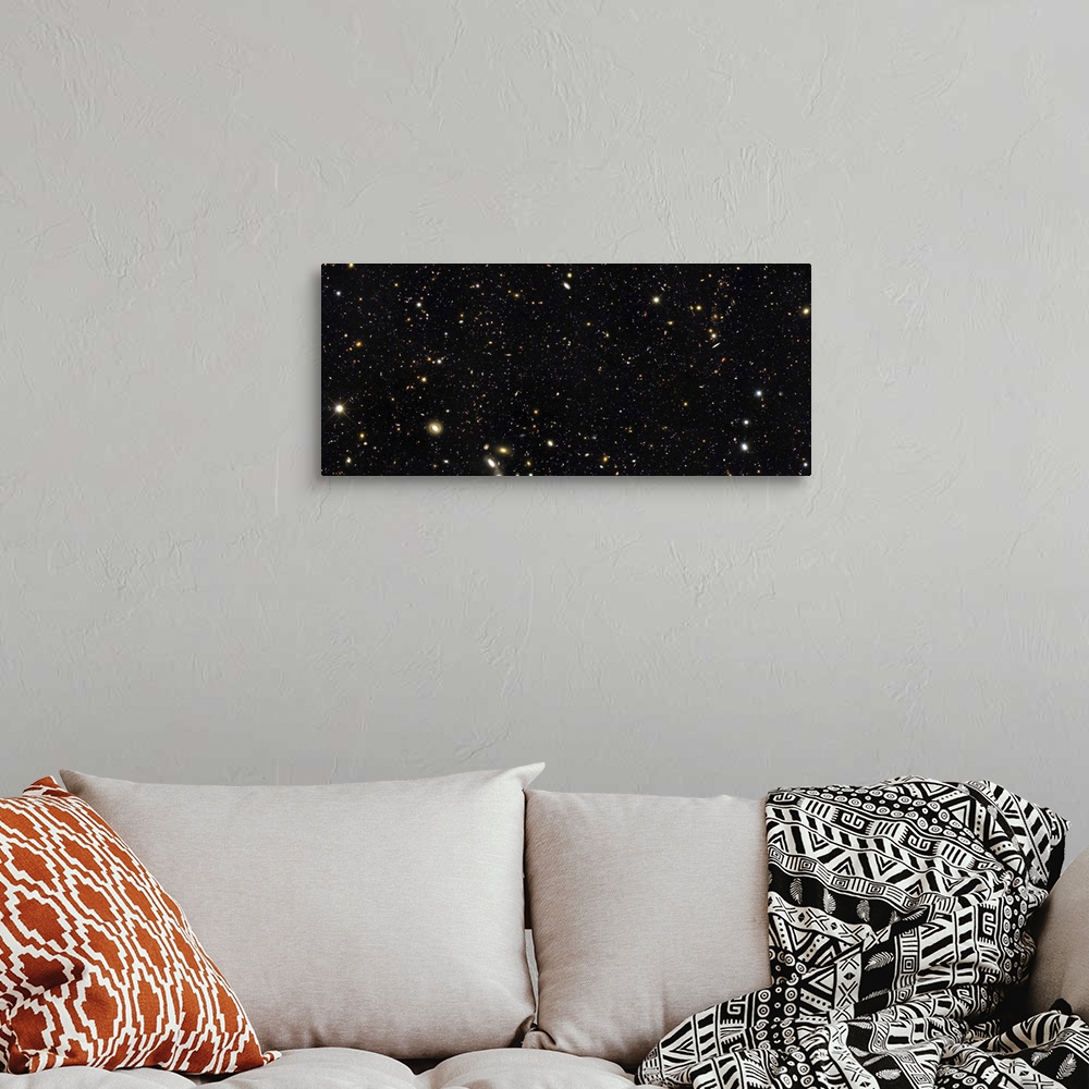 A bohemian room featuring Space photo of the night sky showing the thousands of galaxies in our universe. This small area o...
