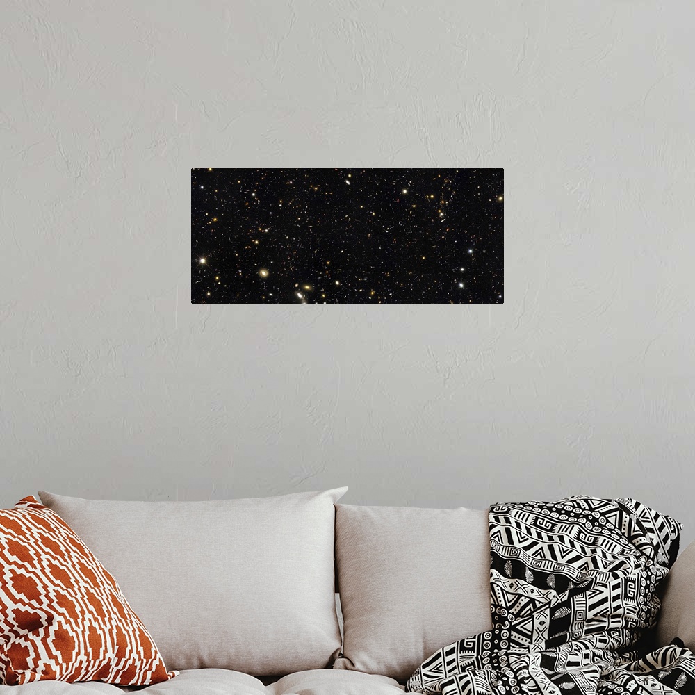 A bohemian room featuring Space photo of the night sky showing the thousands of galaxies in our universe. This small area o...