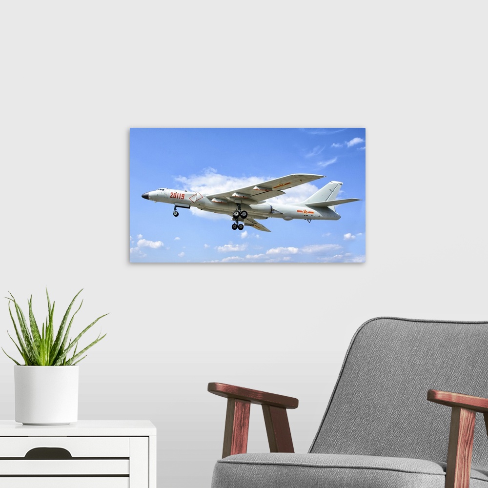 A modern room featuring A People's Liberation Army Air Force Xian H-6K strategic bomber plane.