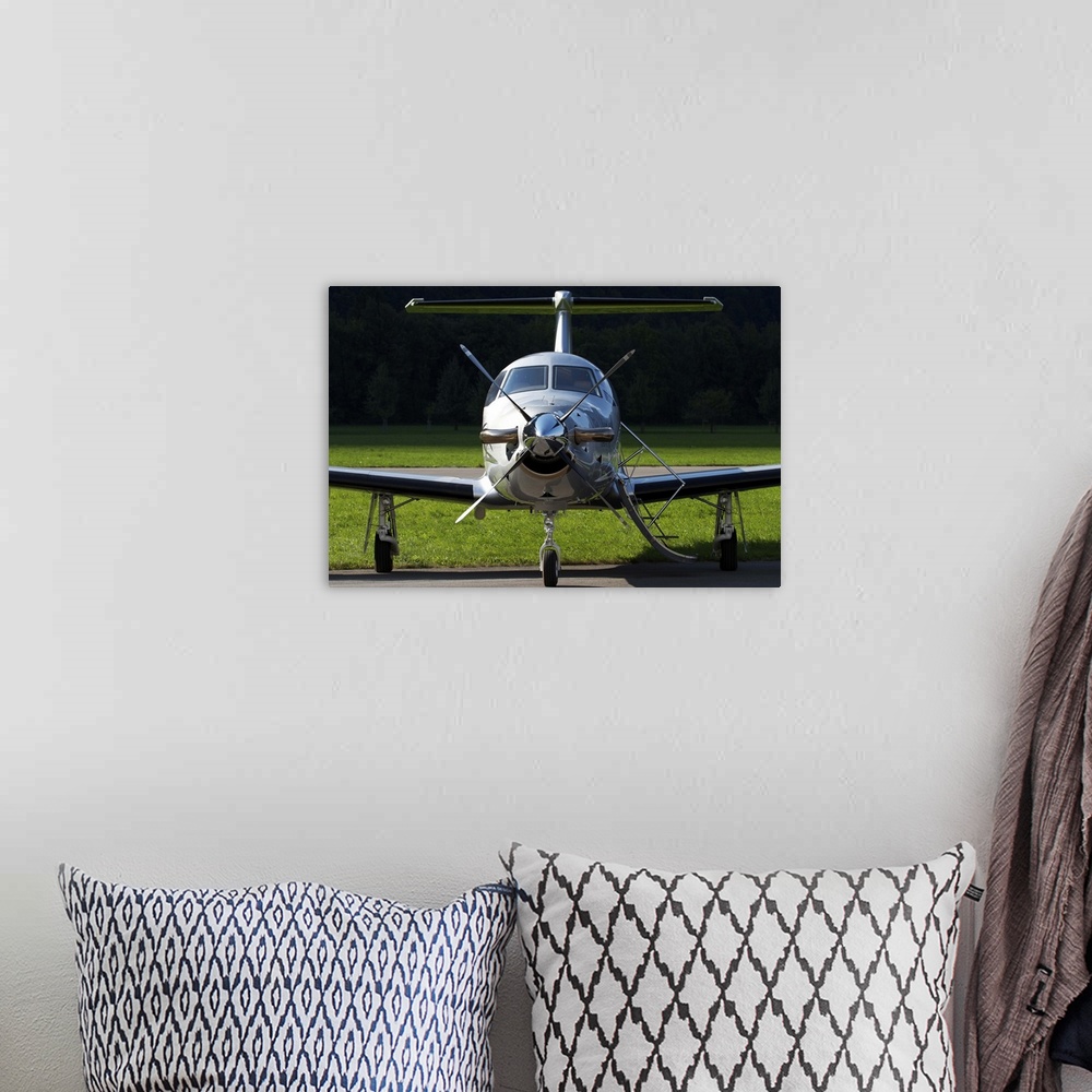 A bohemian room featuring A Pilatus PC-12 private jet, Mollis Air Base, Switzerland.