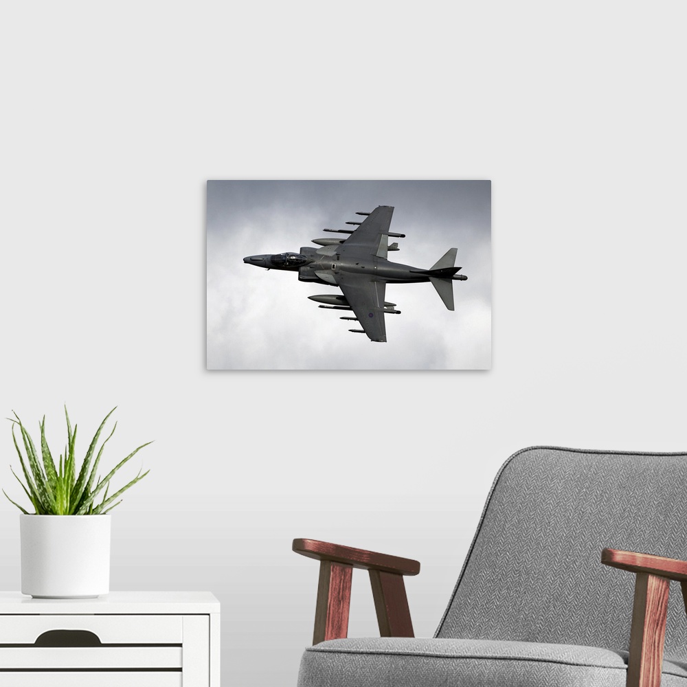 A modern room featuring A Royal Air Force Harrier GR9 flying low over North Wales. The Harrier GR9 is a single seat, mult...