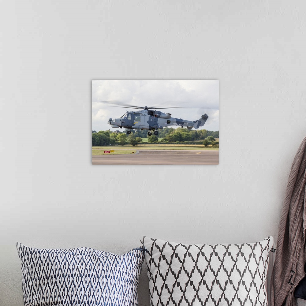 A bohemian room featuring A Royal Navy Wildcat helicopter landing at RAF Fairford in the United Kingdom.