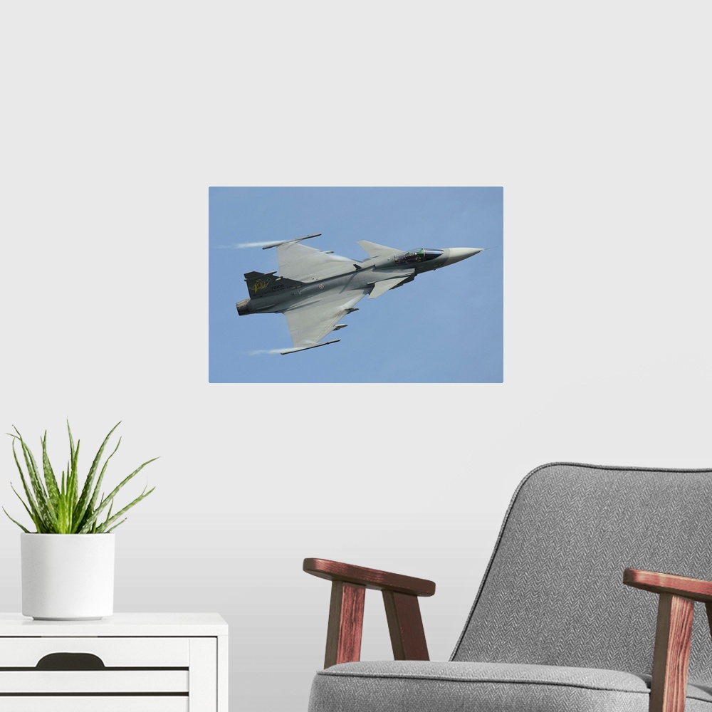 A modern room featuring A Saab JAS 39 Gripen C of the Royal Thai Air Force in flight.