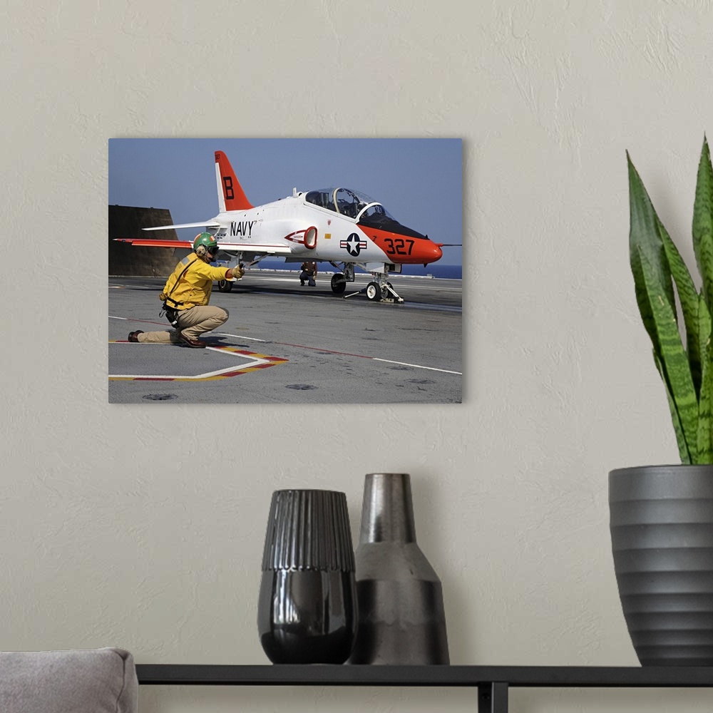 A modern room featuring Atlantic Ocean, June 13, 2010 - A shooter launches a T-45A Goshawk assigned to Training Wing 2 fr...