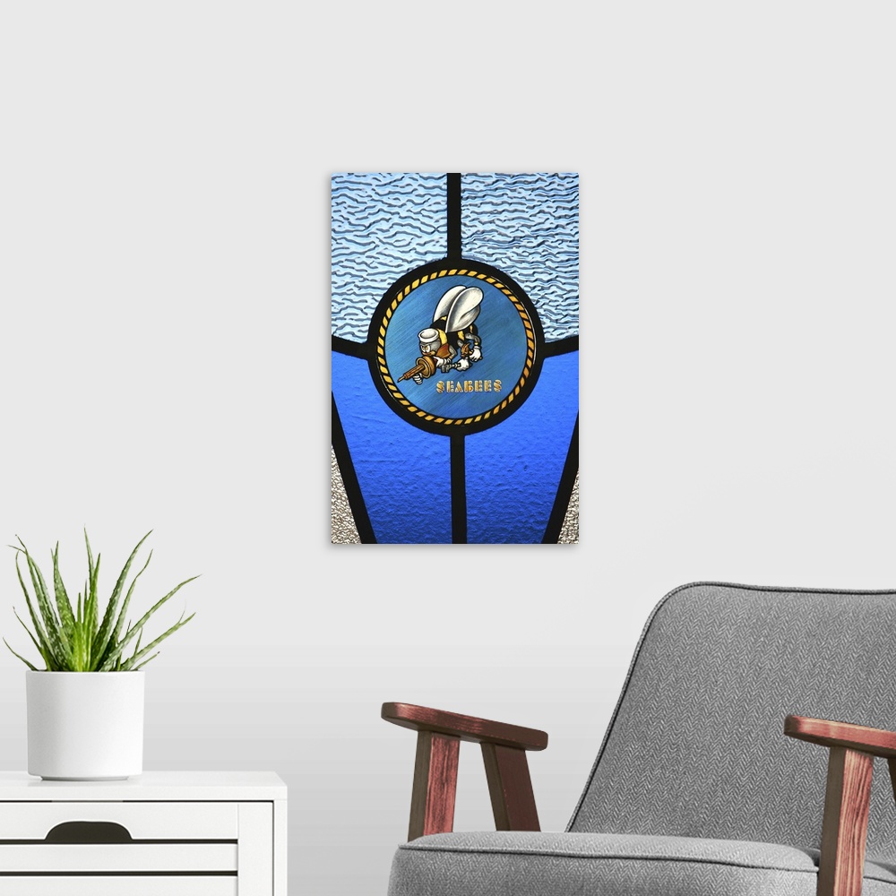 A modern room featuring A single Seabee logo built into a stainedglass window