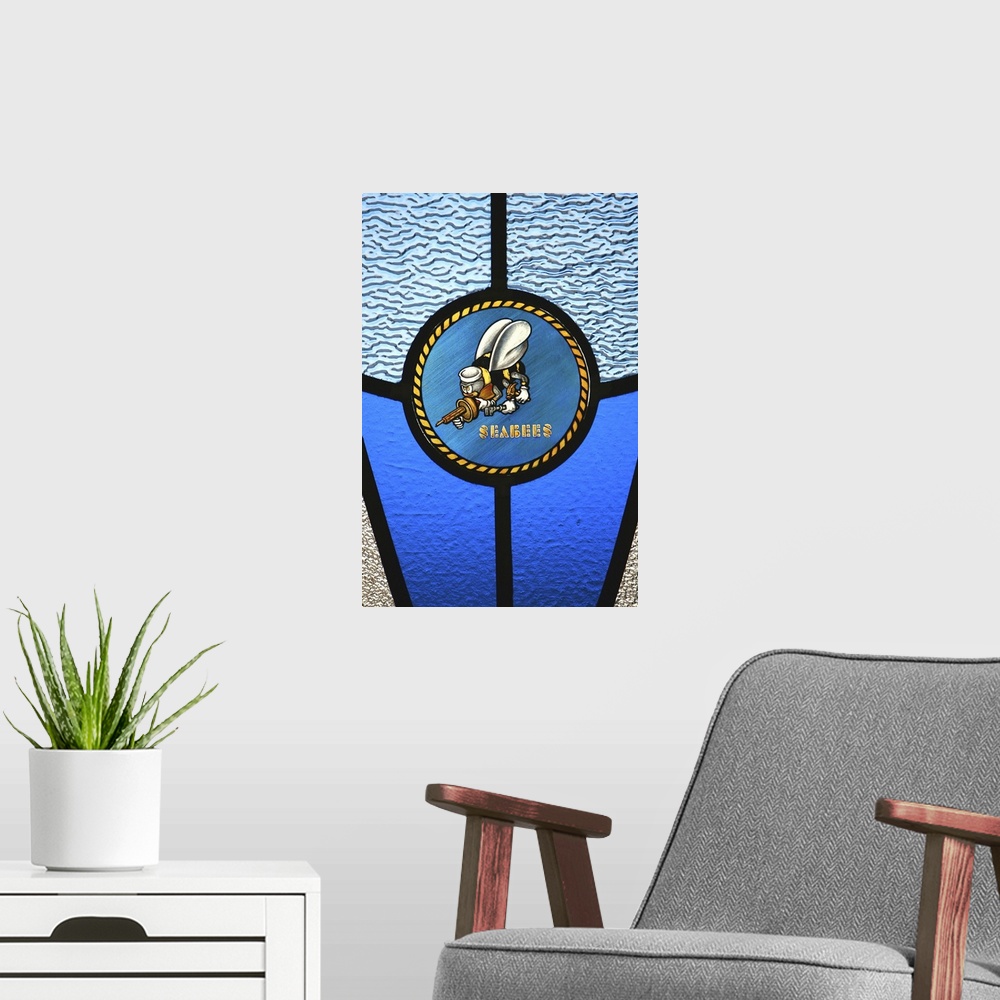 A modern room featuring A single Seabee logo built into a stainedglass window
