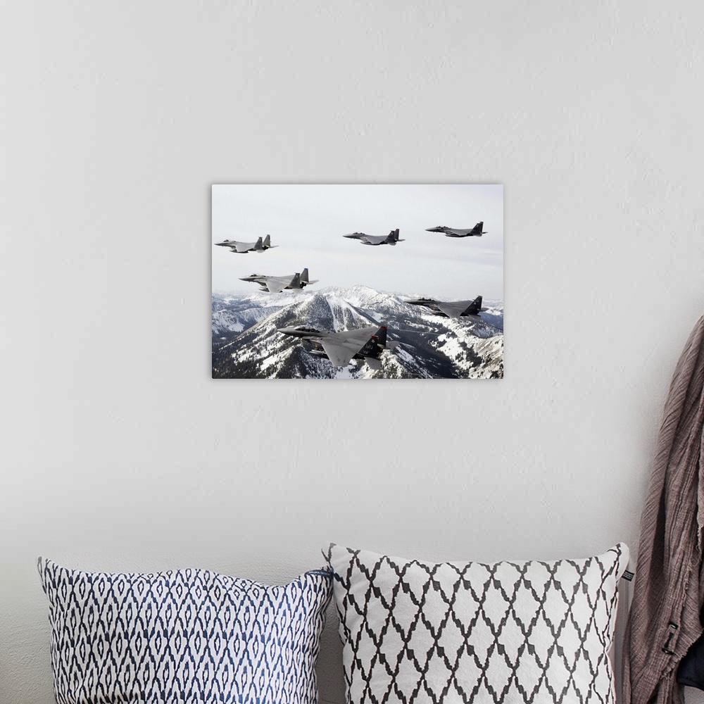 A bohemian room featuring Photograph of airplanes or jets flying over snow covered mountains.