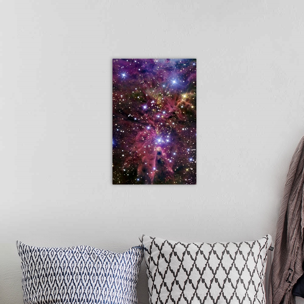 A bohemian room featuring This large piece consists of a cluster of bright stars with warm colored gases throughout.