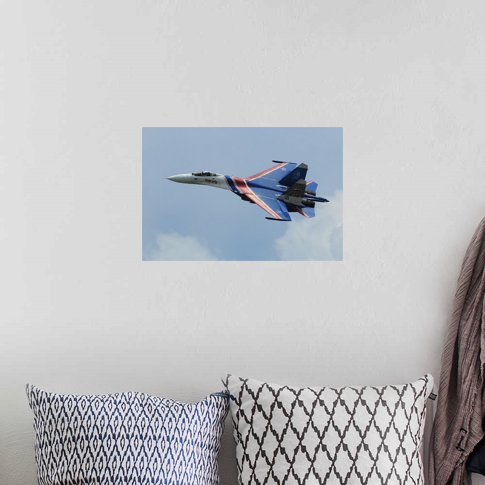 A bohemian room featuring A Sukhoi Su-27 Flanker of the Russian Knights aerobatic team.