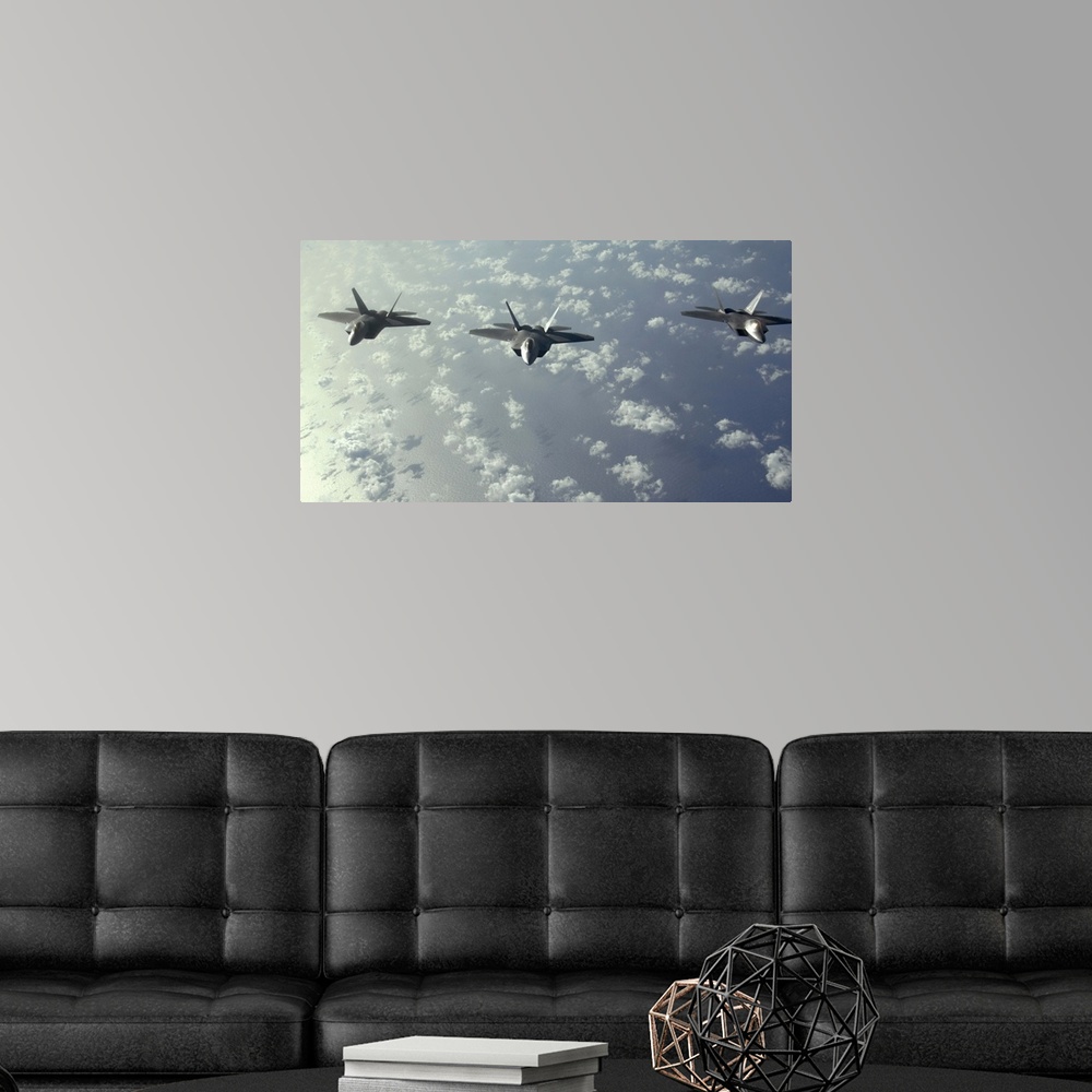 A modern room featuring A threeship formation of F22 Raptors fly over the Pacific Ocean