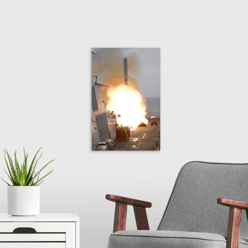 A modern room featuring San Diego, June 22, 2010 - A tomahawk missile launches off the aft vertical launching system aboa...