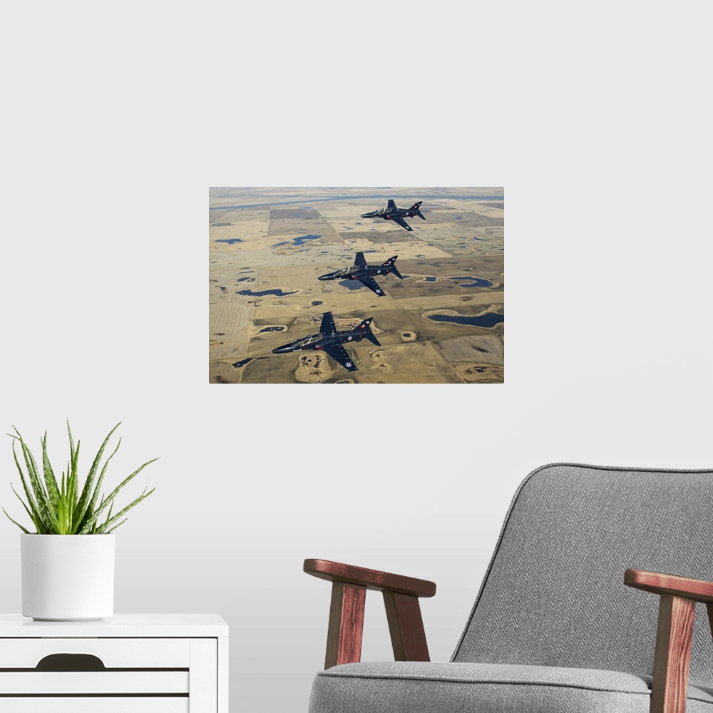 A modern room featuring A trio of Royal Canadian Air Force CT-155 Hawk training jets on a formation flying training fligh...