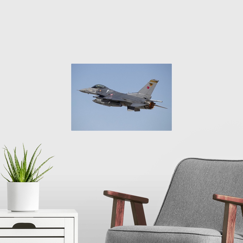 A modern room featuring A Turkish Air Force F-16 Fighting Falcon taking off in full afterburner. The Turkish Air Force ha...