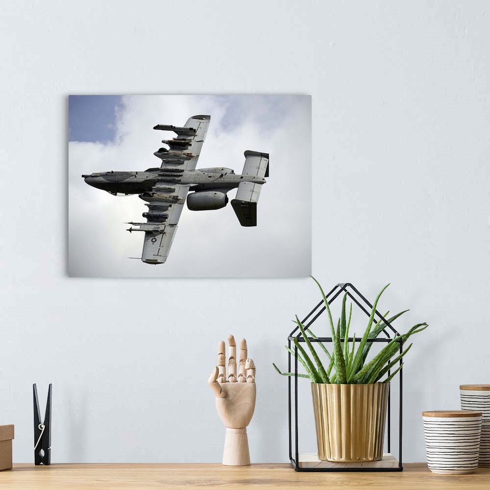 A bohemian room featuring August 22, 2013 - A U.S. Air Force A-10 Thunderbolt aircraft maneuvers after locating a simulated...