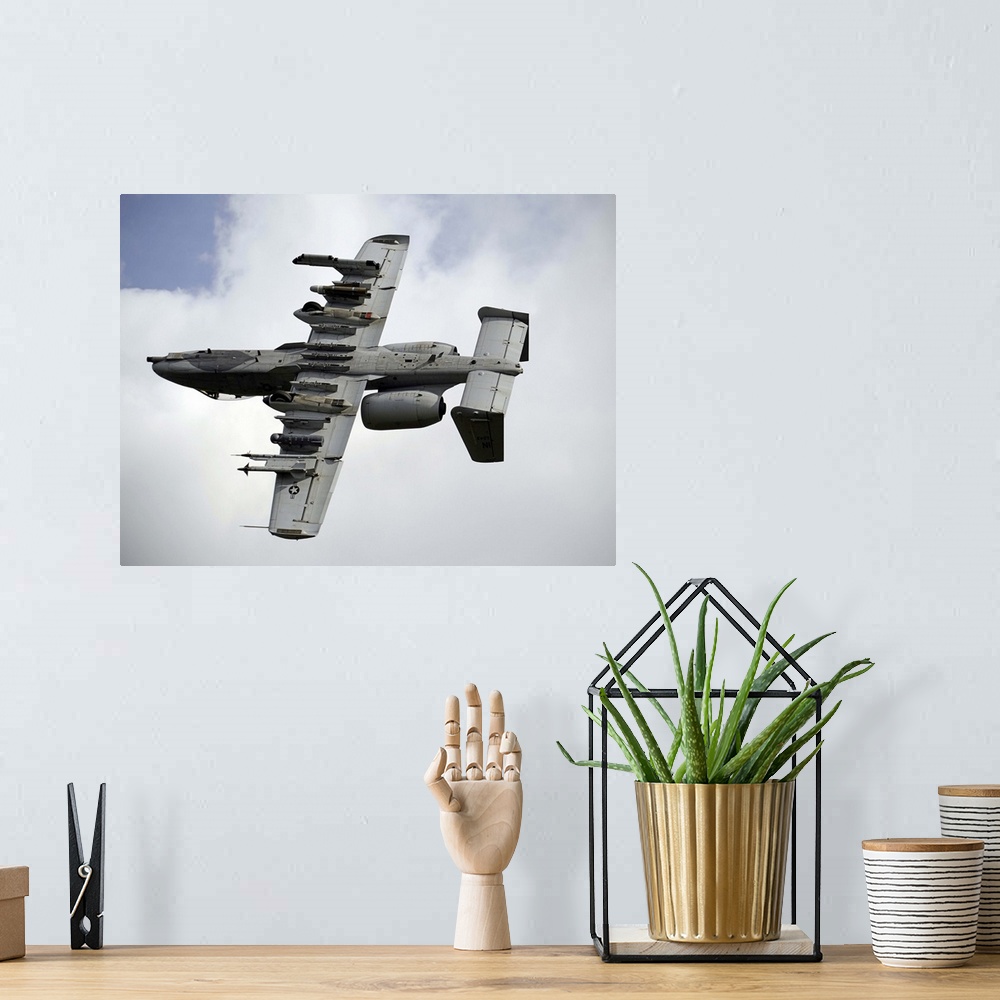 A bohemian room featuring August 22, 2013 - A U.S. Air Force A-10 Thunderbolt aircraft maneuvers after locating a simulated...