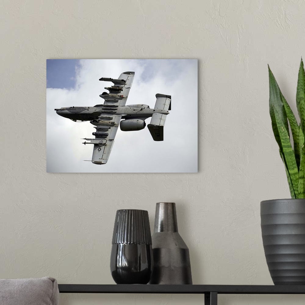A modern room featuring August 22, 2013 - A U.S. Air Force A-10 Thunderbolt aircraft maneuvers after locating a simulated...