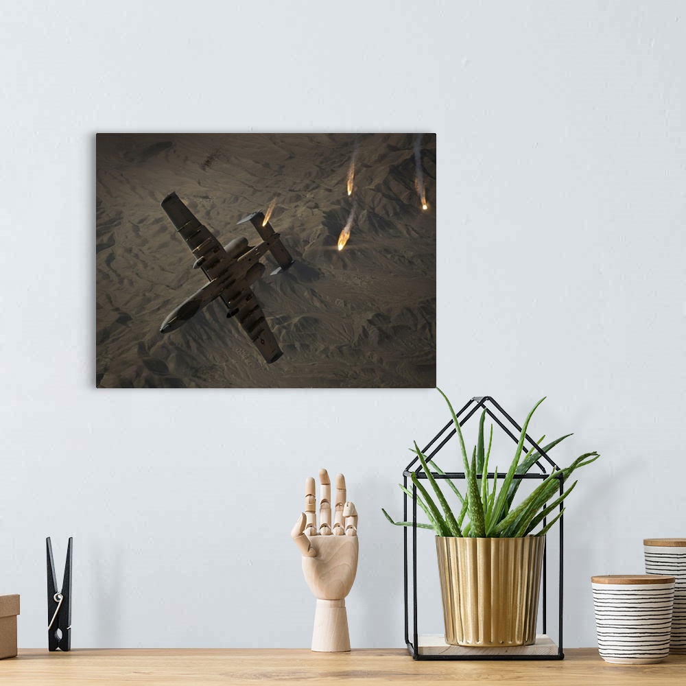 A bohemian room featuring A U.S. Air Force A-10 Thunderbolt II pops flares.