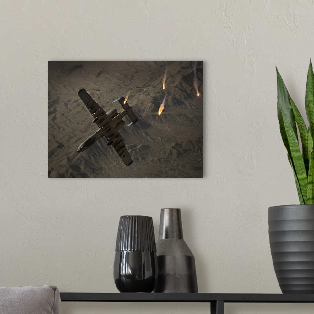 A modern room featuring A U.S. Air Force A-10 Thunderbolt II pops flares.