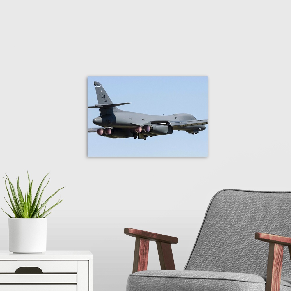 A modern room featuring A U.S. Air Force B-1B Lancer takes off from RAF Fairford, England.