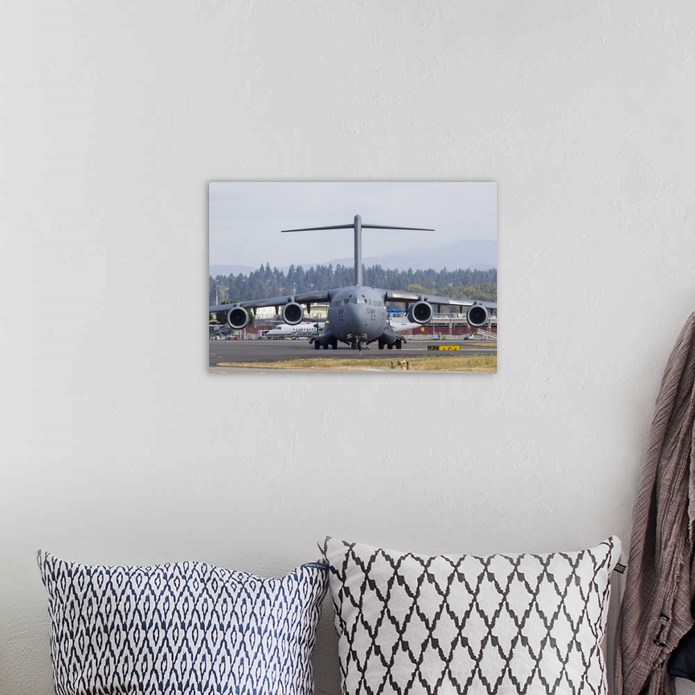 A bohemian room featuring A U.S. Air Force C-17 Globemaster III taxis in after landing at Portland International Airport, O...